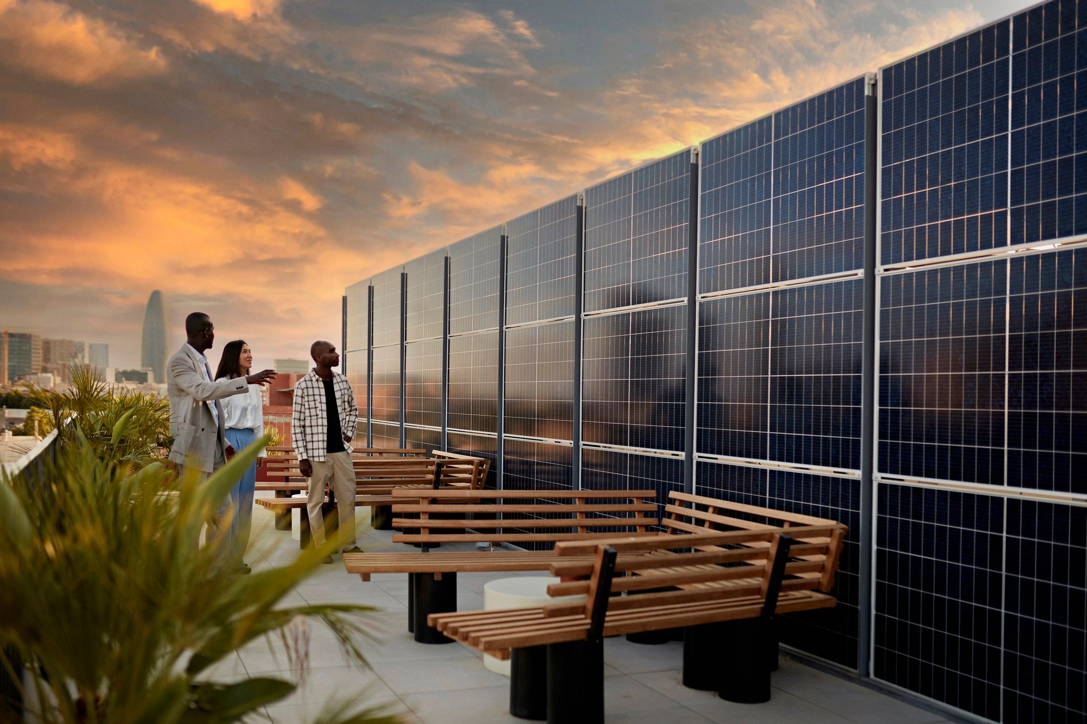 Community members learning about renewable energy on a rooftop