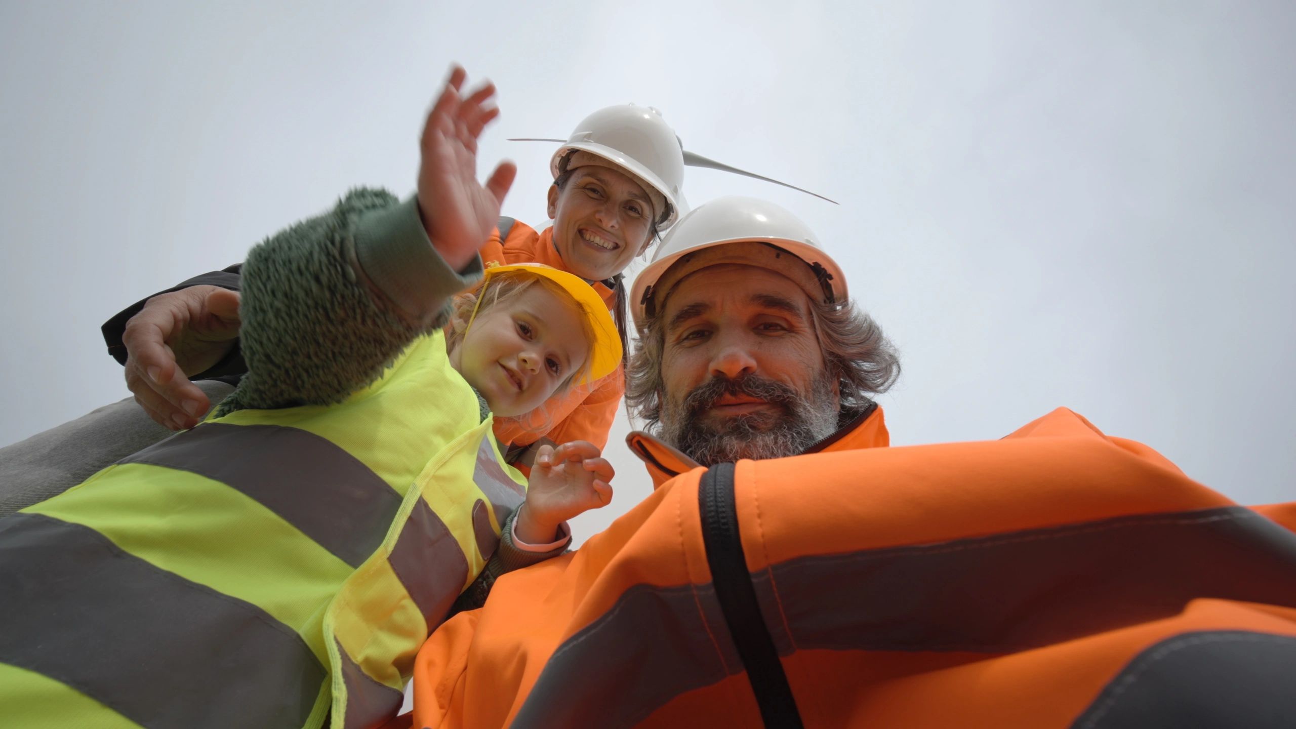 Family and engineers visiting a wind energy site